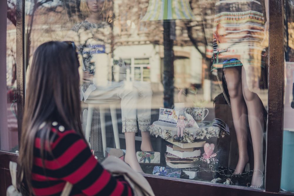 Woman looking in shop window